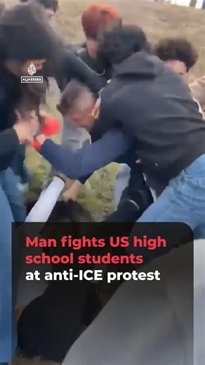 A 45-year-old man has reportedly been charged with assault, after he was filmed fighting high school students in Texas during a protest against immigration enforcement agency ICE. | Al Jazeera English
