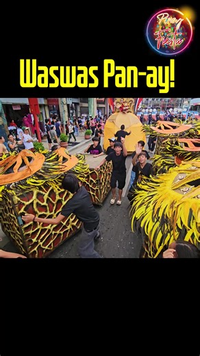 These propsmen, brimming with pride shouting and dancing with incredible energy, perfectly synchronized with the lively drums beating out a rhythm that must have vibrated through the air. And amidst all this vibrant movement, they were powerfully singing 'waswas pan-ay' while simultaneously pushing that heavy riser. Tribu Pan-ay 2025 DnK @top fans Iloilo Dinagyang Festival #tribupanay #DinagyangFestival | Pinoy Fiesta