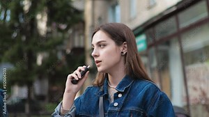 Couple Denim clothes On date in a vintage restaurant outside Smoke electronic heated cigarettes Vape