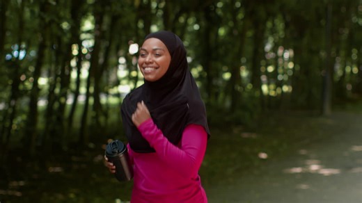 Woman Running in Park | Premium Stock Video Footage