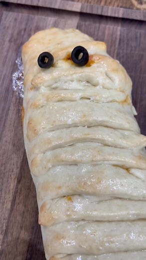 1.1K views · 11 reactions | This mummy pizza calzone is perfect for Halloween_ #marthawhitepartner Recipe -2 packs of Martha White Pizza Crust -1 cup of water -pizza sauce -moz #6222 | Munchies | Facebook