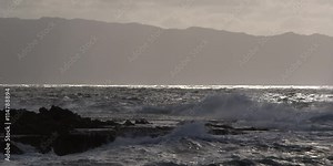 Foaming waves exploding close to the camera on a rocky reef Stock Video