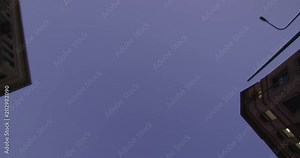 Reflection Plate of a Driving Plate: This view shows only the sky and objects seen above the car as it turns left from 3rd Street onto Broadway in Los Angeles, continues to a right turn onto 5th Street, and travels one block on 5th to a stop light.