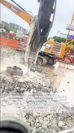 Excavator Operator Crushing Concrete Waste with a Hydraulic Breaker