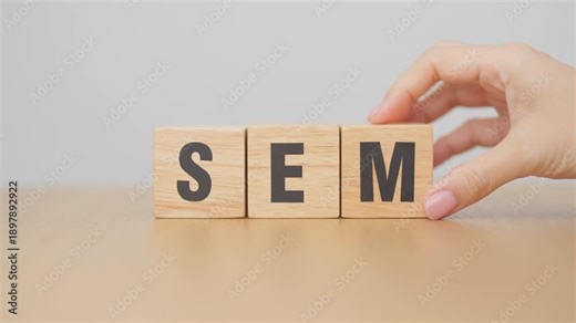 Hand change Wooden block from SEO to SEM. Search Engine Optimization, SEA, Advertising, Marketing, Idea, Strategy, Keyword, Content and technology concept