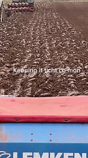 Tractors Plowing an Agricultural Field in Rural Setting