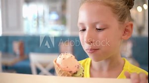 Cute Girl eats Ice cream Cone, licks it with Tongue