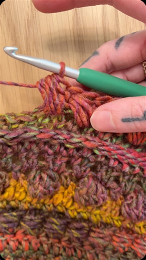 Of Mars on Instagram: "Wrapped puff stitch. I use variations of this in all my Fable patterns! Pictured is a new Fable design I’m working on  Working with @redheartyarns Roll With It Melange in Curtain Call ❤️ and using a 5.5 @cloverusa hook "