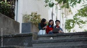 Classmate student friend sit and talk about learning content subject in classroom on laptop within university or high school