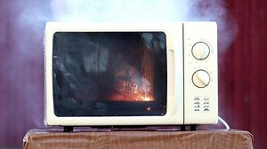 clip-1091806027-ignition-inside-microwave-oven-due-malfunction-misuse