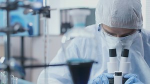 Man using a microscope - Free Stock Video