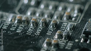 Computer parts macro closeup. Camera moving above structures of chips, microchips and processors on used board.