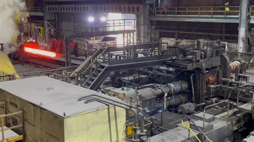 At British Steel, quality is at the heart of our operations. Today, as part of World Quality Week, we have a video from our Scunthorpe Rail and Section Mill which shows a bloom, heated to temperatures of 1,170 degrees, entering the roughing mill. There, it will undertake 7 passes back and forth through the rollers, reducing the cross-sectional area and beginning the shaping process for the profile. The bloom can be tilted by the entry and exit manipulation to allow rolling to occur in both plane