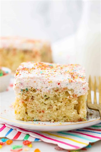 If you love Fruity Pebbles, this poke cake recipe is for you! This Fruity Pebble Poke Cake is a delicious vanilla cake, soaked in sweetened condensed milk and topped with a homemade Fruity Pebble Whipped Cream! Grab the recipe: https://beyondfrosting.com/fruity-pebble-cereal-milk-poke-cake/ | Beyond Frosting
