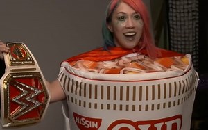 Asuka Poses In Cup Noodles Costume Following RAW Women's Title Win At WWE SummerSlam