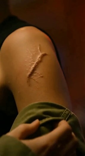 They mocked her, called her a fake soldier, and forced her to prove it — but when they saw the scar on her shoulder, the room fell silent. They laughed when she walked into the bar wearing her old uniform. Someone shouted, “Take it off if you’re a real soldier!” And when she finally did — when her jacket slipped down and the scar on her shoulder caught the light — the laughter died, replaced by something heavier than guilt. It was a small-town bar in Minnesota, lit by neon beer signs and the fli