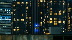 Exterior Elevator Time-lapse. Office lights blink on and off at the end of a long and busy work day in downtown Los Angeles, California.