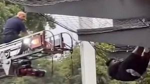 Golfer falls into Topgolf net, needs firemen to help him out