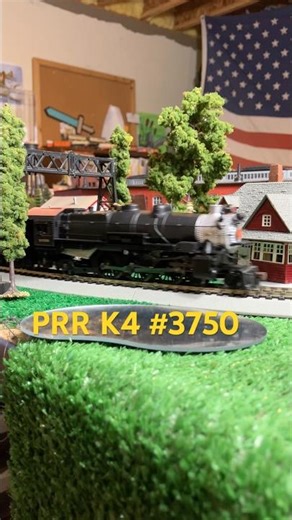 Ho scale model Pennsylvania railroad K4 pacific hauling a commuter train.