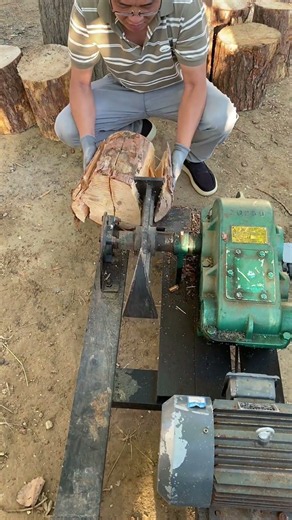 Real wood-chopping scene. A household wood-chopper in use in rural areas – truly effective.