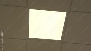 modern led light panel turns on in slow motion, closeup of light turning on