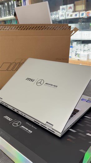 MSI Prestige 16 AI Mercedes-AMG B2VMG-094KH - Intel® Core™ Ultra 9 288V | AI Boost NPU - LPDDR5 32GB | Storage : 2TB Gen4 - 16" 16:10 UHD OLED, 100% DCI-P3 - GPU : Intel® Arc™ Graphics - Single backlight (Red) with Copilot Key - OS : Windows 11 License - 4-Cell 99.9 Battery (Whr) - 1.5 Kg | Urban Silver - Code: L001-AMGB2VMGA3 ------------------------ - Free : Prestige Motorsport Gift pack - Free : Mouse Pad ---------------------------- 🛒ធ្វើការបញ្ជាទិញ | 🛺 ដឹកជញ្ជូនគ្រប់ខេត្តក្រុង -----------