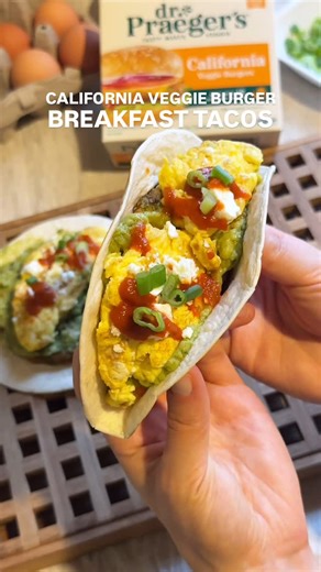 Dr. Praeger's on Instagram: "Fuel your morning with these veggie-packed breakfast tacos 🌱🤩 Dr. Praeger’s California Veggie Burgers for the perfect blend of flavor and protein. Here’s what you need: • 2 Dr. Praeger’s California Veggie Burgers • Tortillas • Guacamole • Eggs • Feta Cheese • Sriracha • Scallions #drpraegers #veggieburger #breakfasttaco #tryalittleeasier"