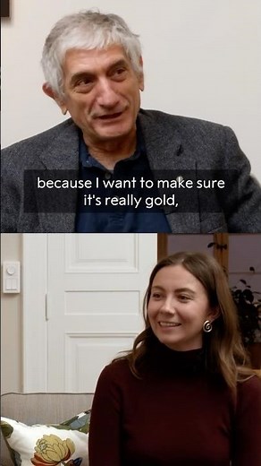 Nobel Prize laureate John Martinis talks medals, real and chocolate, with student Eleonora Svanberg.