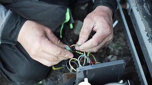 Electrician installs wiring using Connectors for connecting wires in automation and electronics equipment. Connection of electrical wires of electrical appliances