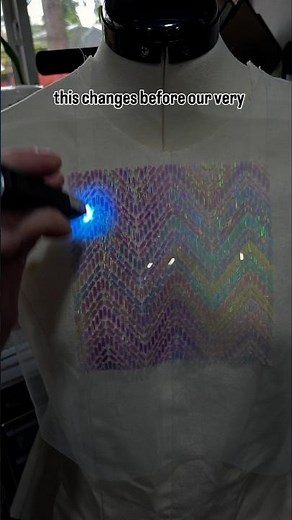 3d printed textile experiment with white to purple uv reactive filament behind recycled pla layers