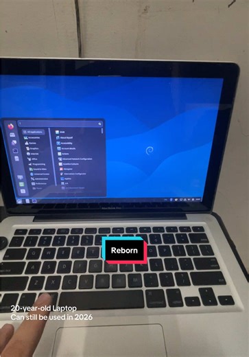 Reviving a 20-Year-Old Laptop: A Journey with Debian 13