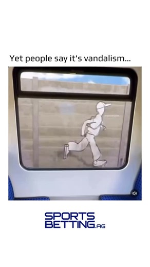 @earthspctr on Instagram: "This video shows a view from inside a train carriage, looking out through a window. Outside the window – or appearing as if on the concrete wall or barrier right next to the tracks – there is a large, simple line drawing or stencil of a cartoon-like figure. It depicts a person wearing a cap, carrying what looks like a bag or briefcase, walking or running in a slightly exaggerated, hunched posture. As the train moves along the tracks, the figure is perfectly aligned wit