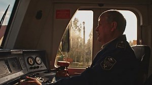 clip-1111157457-male-old-train-driver-control-panel-cockpit