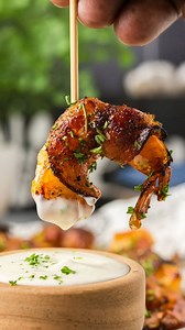 This easy bacon wrapped shrimp recipe is brushed with a sweet and savory glaze then tucked in with crispy bacon that ties all the flavors together. This crowd-favorite appetizer comes together in around 35 minutes. #baconwrappedshrimp #shrimp #appetizers #footballfood #gamedayfood 🔗 https://amandascookin.com/bacon-wrapped-shrimp/ | Things I Love