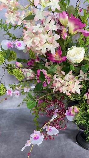 8.9K views · 165 reactions | What do you think of this asymmetrical silk flower arrangement? Once you master wreaths, you expand to other revenue generating designs such as rentals or event pieces. Here’s one I tested for the Wreath Makers Live stage. | Southern Charm Wreaths | Facebook