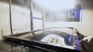 vacuum thermoforming machine in the factory. thermal vacuum molding process. Obtaining volumetric parts from plastic.