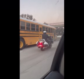 Cop Watching Baseball Game on Motorcycle