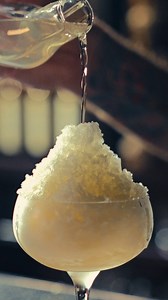 1K views · 31 reactions | Sometimes it's okay to eat the yellow snow... Stop by the Bamboo Room and try our Banana Daiquiri, a masterful blend of clarified banana cordial, Caribbean white rum, and lime acid poured over freshly shaved banana snow. Served in a hand-blown glass banana, it's accompanied by freeze-dried banana, macadamia nuts, and toasted coconut. | Three Dots and a Dash | Facebook