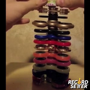 THIS JUST IN: The world record for the "Tallest Fidget Spinner Tower" has just been BROKEN. It now stands an incredible 13 FIDGET SPINNERS high! | RecordSetter