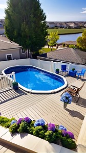 248 reactions | Can you imagine spending your afternoon right here?  This sleek above ground pool is tucked into a bright deck with comfy seating, hydrangeas in full bloom, and a view that’s straight out of a postcard  Now this is backyard luxury! #abovegroundpoolstyle #deckdesignideas #backyardviews #patiofurnituregoals #summervibesdaily #poolsideplants #homeinspooutdoors #backyardretreat | The Pool Factory | Facebook