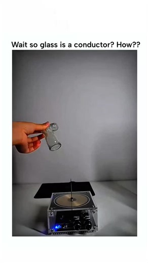 Crazy Master on Instagram: "The post showcases a plasma globe video where purple plasma filaments respond to hand touches on the glass surface, prompting the author's surprise at glass seemingly conducting electricity. In reality, glass insulates direct current but permits capacitive coupling with high-frequency alternating current, allowing plasma streams to follow the electric field without electrons crossing the glass. Posted on December 25, 2025, the video amassed 1.7 million views and 986 l