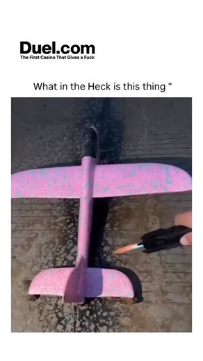 sociofuncasm on Instagram: "The video depicts a pink foam boost glider model airplane ignited with a firework fuse, launching from a riverbank at sunset, climbing with a fiery trail before gliding and splashing down, edited with a reversed landing sequence for dramatic effect. 1 Boost gliders originated in the 1960s as hobbyist kits from brands like Estes and Centuri, using solid-fuel motors for propulsion followed by unpowered descent; this version's firework substitution amplifies thrust but c