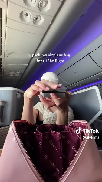 Replying to @Zel 💋 everything you need for a long haul flight ✈️☁️ save for your next trip! airplane bag essentials: - lip balm @Summer Fridays - lip oil @Diorbeauty - moisturizer @Drunk Elephant - mints - hand lotion @chanel.beauty - hair brush - ear plugs - nail file - lavender and eucalyptus essential oil - hair ties - under eye mask - hand sanitizer - feminine wipes @VagisilUS - pens - airPods - portable charger - wired headphones - USB phone charger #planekit #cleangirl #airplanebag #airpl