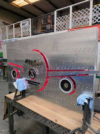 Check out the progress on this sign I've been building! It's made of mostly aluminum featuring real aircraft style rivets, brushed stainless steel, mirror finished stainless steel, custom made logos and LED back lighting. I have one more detail to add then this is ready to install. The C channel around the border will be the cherry on top! #welding #metalfabrication #sign #fyp #capcut