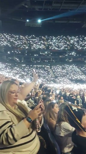 Staying Relevant Show O2 2025, Audience with torches on. Pete Wicks and Sam Thompson.