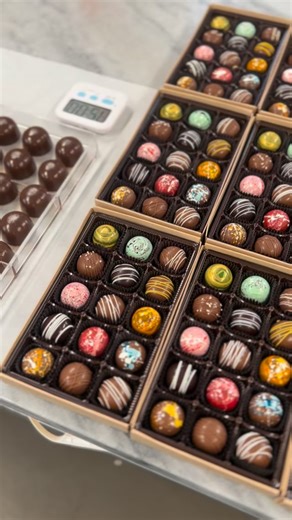 End of the Commons on Instagram: "Gourmet chocolate bon bons are small, luxurious confections designed to delight all the senses. Each bon bon begins with a glossy chocolate shell—often made from high-quality couverture chocolate—carefully tempered to achieve a delicate snap. Inside, layers of flavor unfold: silky ganache, fruit purées, nut pralines, caramel, or liqueur-infused creams, all crafted to balance sweetness, richness, and texture. Artfully decorated with hand-painted cocoa butter, sub