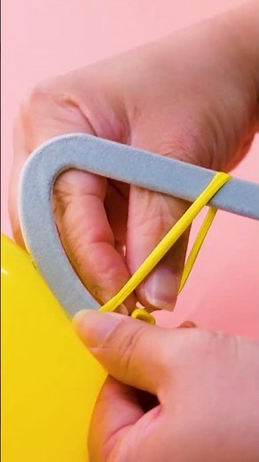 The secret to tying balloons? A clothes hanger!