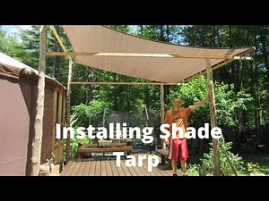 Installing Shade tarp over deck.