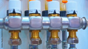 Water taps, pipelines and units level control and adjust the temperature of the water. Shot in motion. Closeup. Dolly shot