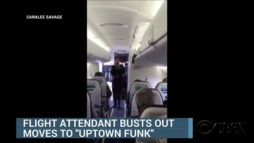 Watch flight attendant bust a move as passengers board